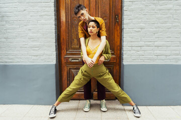 City Love: A Fashionable Couple's Outfits on Display in the Daylight