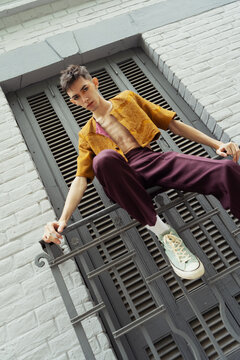 Dressed to Impress: A Young Man's Bold Fashion Statement on the City