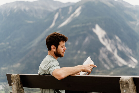 man read book in nature