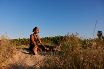 Woman  in countryside during yoga session