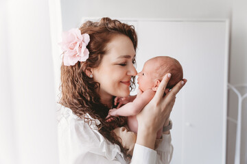 Happy mother holding her son.