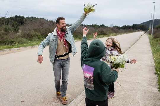 Children Play With Dad Outdoors