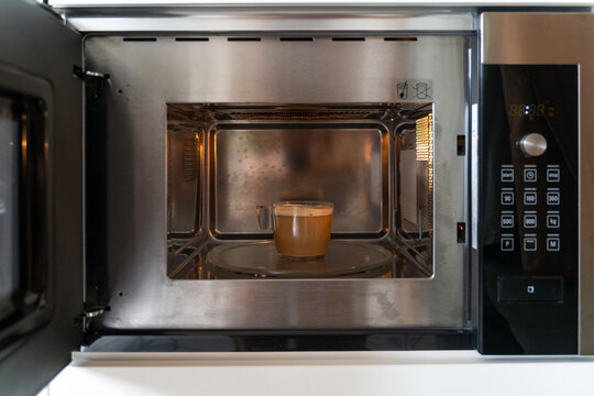 heating coffee inside Microwave
