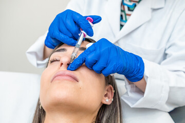 doctor injecting facial and lip treatment