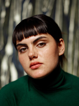 Woman with soulful, penetrating stare looking at camera