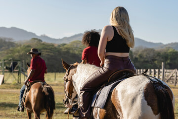 Image of a group of people riding horses.