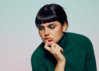 Woman with doutbful expression, trying to decide