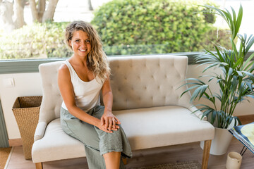 woman happy in waiting room of welfare facility