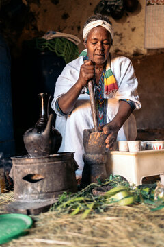 Ethiopian women roasting coffee at traditional home.