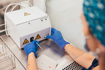 Crop lab technician working with mixing equipment in lab