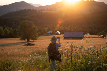 Joyful female tourist relaxing in nature