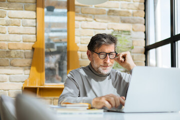 Senior Man Using Laptop