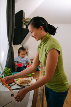 Mother And Son In The Kitchen
