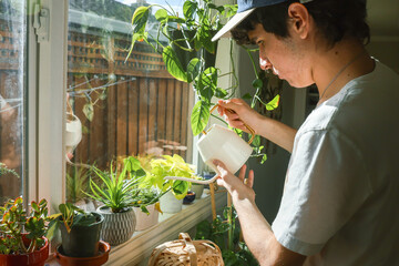 Teenager Caring for Plants