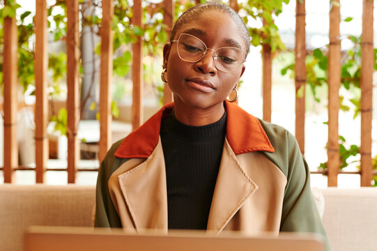 Woman Using A Laptop In A Cafe