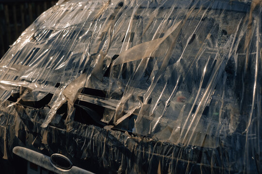 Car window sealed with tape