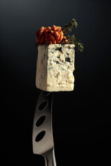 Blue cheese on a knife.