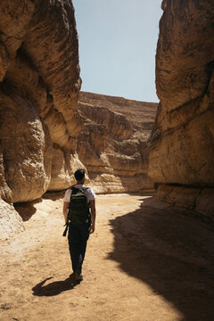 Traveler man in Mides canyon in Tunisia