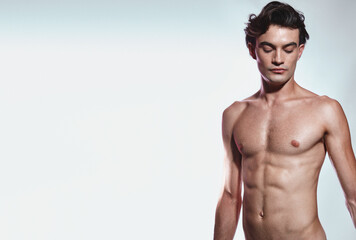 Young man with a toned body and glowing skin