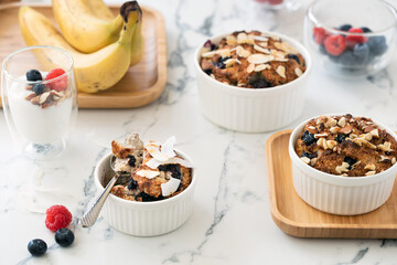 Healthy paleo muffins served in white dishware with berries and nuts