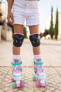 little girl on roller skates in the city