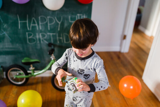Boy opening presents for birthday