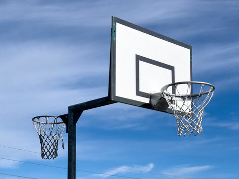 Basket ball hoop and board with netball hoop