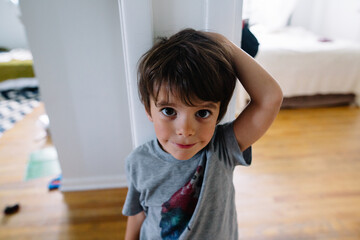 Boy measures his height on wall