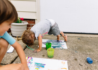 Boy shows off canvas painting
