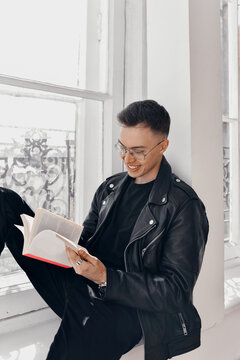 Handsome guy flips through the book