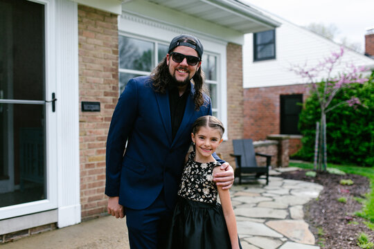 Father and Daughter pose for photos before dance