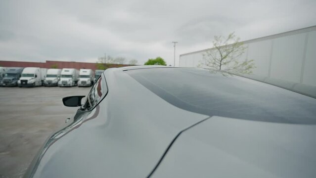 revealing freshly cleaned sport car on a truck parking yard