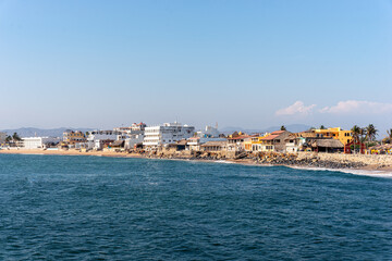 Fototapeta na wymiar Boardwalk of Barra de Navidad beach, cihuatlan, Jalisco, mouth of river, Melaque Beach, Costalegre, cabo of mexico, bay of navidad.