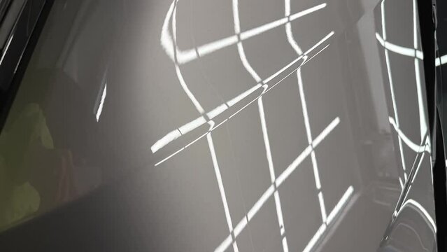 Hood of Grey mirror premium car in the detaling center after polishing. High quality FullHD footage.Vertical video