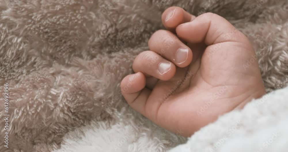 Sticker A right hand of sleeping asian baby on the carpet handheld