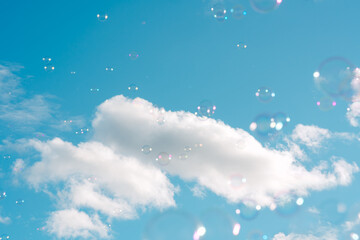 Sunny blue sky and soap bubbles