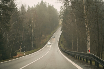 Multi-lane highway road. Road markings with white paint on asphalt. Empty interstate motorway.