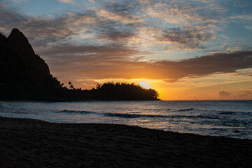 Sandy Beach and Mountains at Sunset in Kauai Hawaii