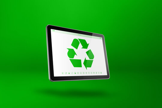 Digital tablet PC with a recycling symbol on screen. environmental conservation concept