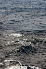 Waves ocean spray tides stormy day on Atlantic Ocean during transatlantic crossing on legendary ocean liner