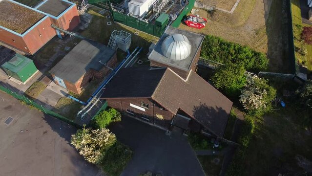 Aerial view looking down at Pex hill Leighton observatory silver dome rooftop on hilltop farmland at sunrise
