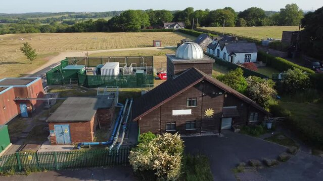 Aerial view Pex hill Leighton observatory silver dome rooftop on hilltop rural farmland at sunrise
