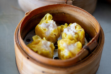 Siu Mai - Chinese steamed pork dumplings in bamboo steamers.