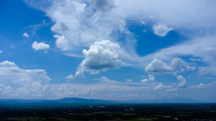 Green mountains and beautiful clouds under blue sky. Beautiful mountain landscape with bright sky.