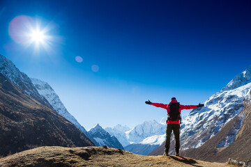 Victorious man Enjoying the Success in Himalayas Mountains, Nepal