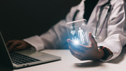 Medical technology concept. Doctor working with smart phone and laptop computer.