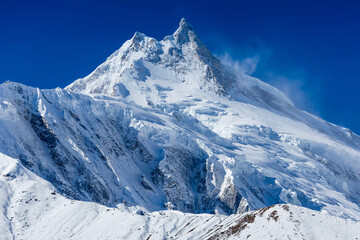 Fototapeta na wymiar Himalaya scenic mountain landscape against the blue sky. Manaslu mountain