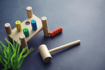 Children's development. Children's wooden toy on the table in the play area. Room of children's creativity and self-development. Wooden constructor.
