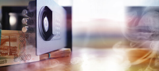 Fototapeta premium Deposit in cash. Russian rubles are in the safe. money in a residential safe close-up photo.