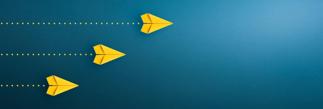 Yellow paper plane on blue background, Success in business growth concept. copy space